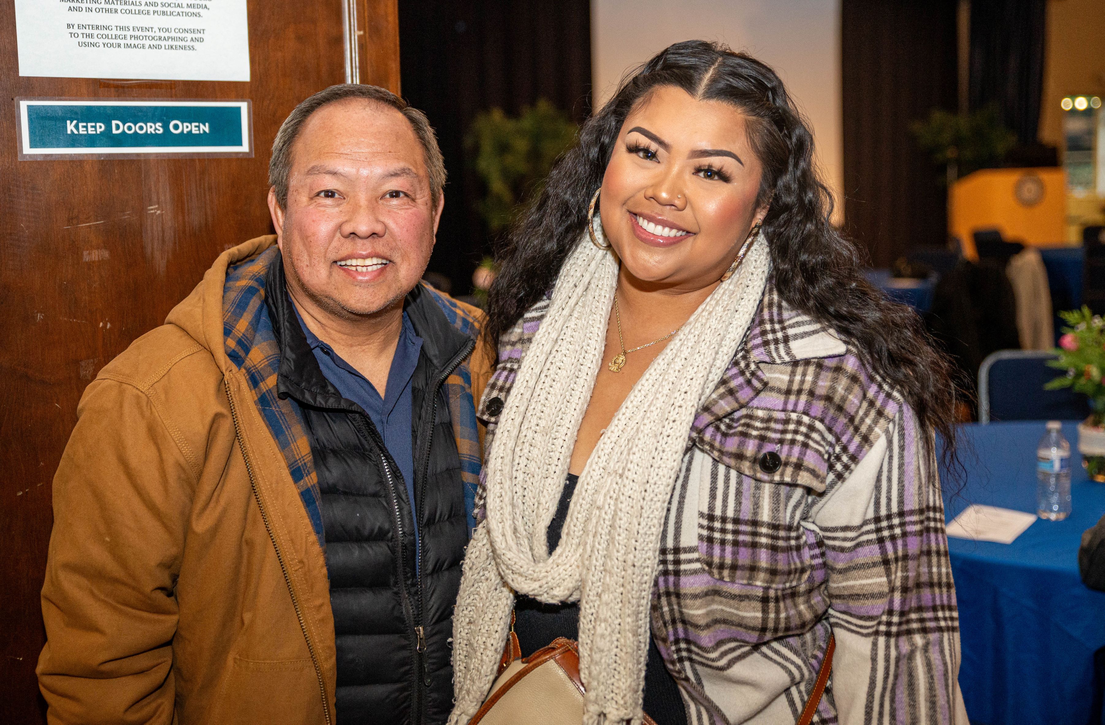 Caroline Arcega (right) stands next to her father Rommel Arcega (left)