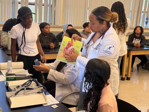 A photo shows Touro University California medical student Destany Michael, center, was she talks with students at Elite Public Schools in Vallejo about what it\'s like to study medicine, Monday, March 23, 2026. She was joined by fellow medical students Tanaejah Miller, Beatrice Ojekunle, and Hashima Dailey. The four medical students serve on the board of TUC\'s first Student National Medical Association (SNMA) chapter. The goal of the visit to Elite Public Schools was to expose students to the medical field and inspire them to pursue a field of study related to science or medicine.