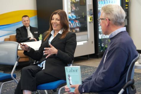 A photo shows Dr. Mary Afsari, DO 2006, center, as she gestures while discussing her memoir, "Labor: One Woman\'s Work," April 27, 2026.