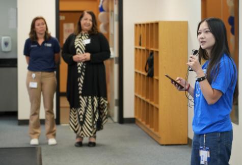 Student Doctor Isabella Tan, SGA Vice President for Athletics, is shown at right as she welcomes guests to the opening of a new consolidated gym located in Lander Hall, Monday, Aug. 10, 2026. Shown standing in the background are Yvette Elizabeth Carrillo, Director of Student Activities, left, and Dr. Tami Hendriksz, Campus Provost and Dean of the College of Osteopathic Medicine, center.