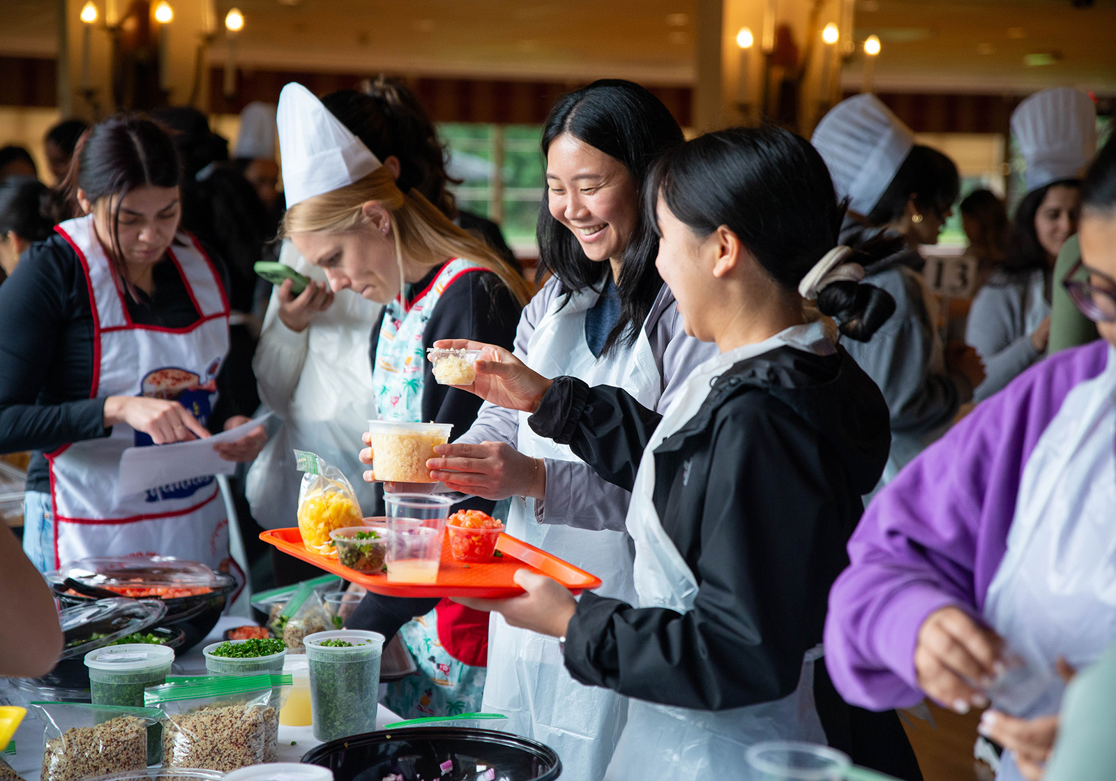 Group of students holding food cups for Culinary Medicine course