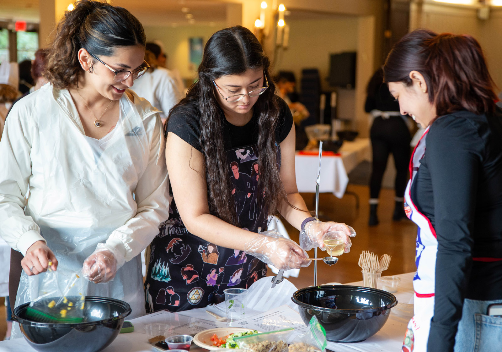 Student prepare healthy food at a table