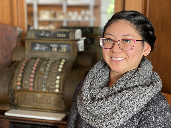 A photo shows Touro University California MPH alumna Ashley Cumpus inside The Quarters Coffee House, Thursday, Jan. 11, 2024.