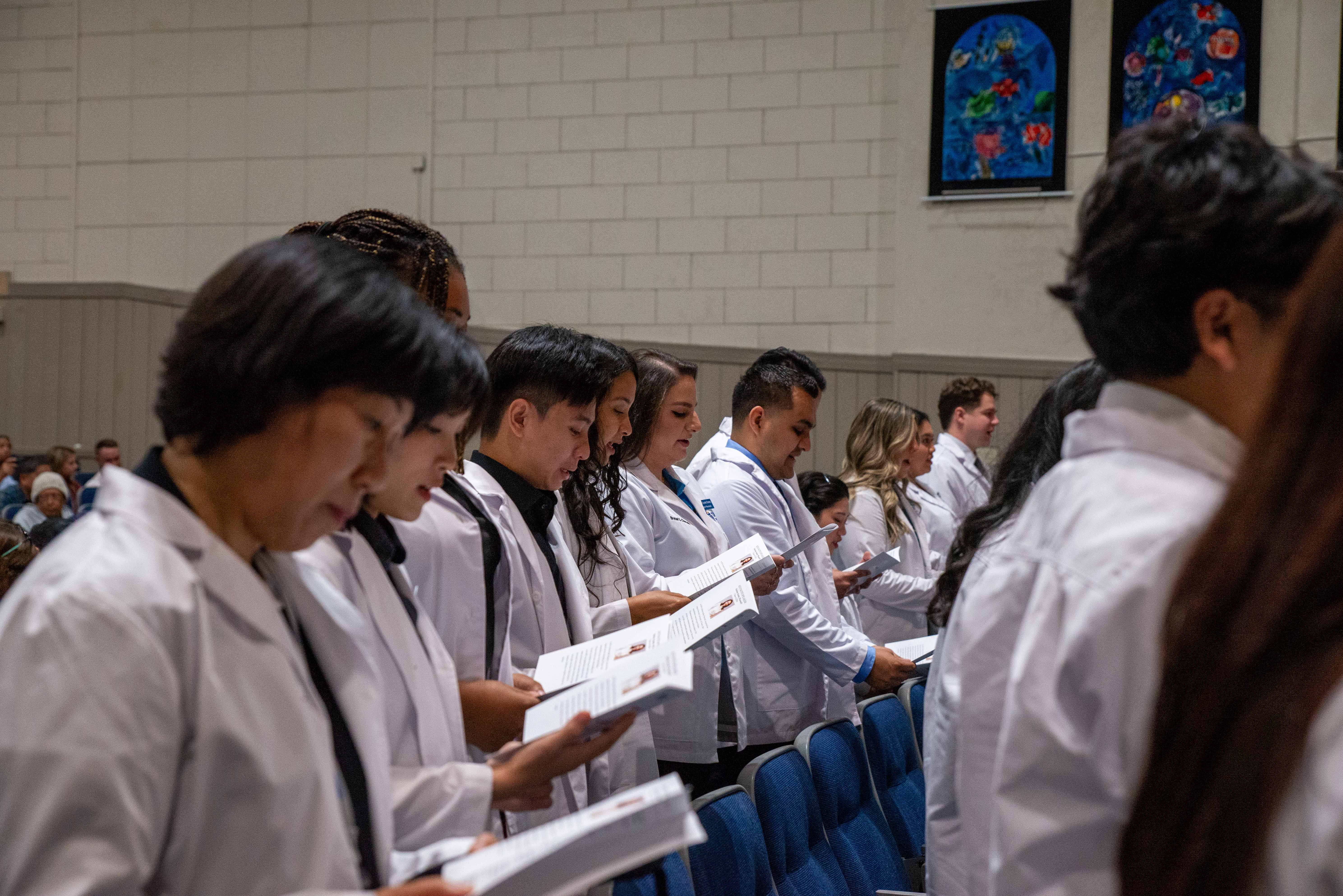 Class of 2028 PharmD students recite the Pharmacist Oath at the 2024 White Coat Ceremony.