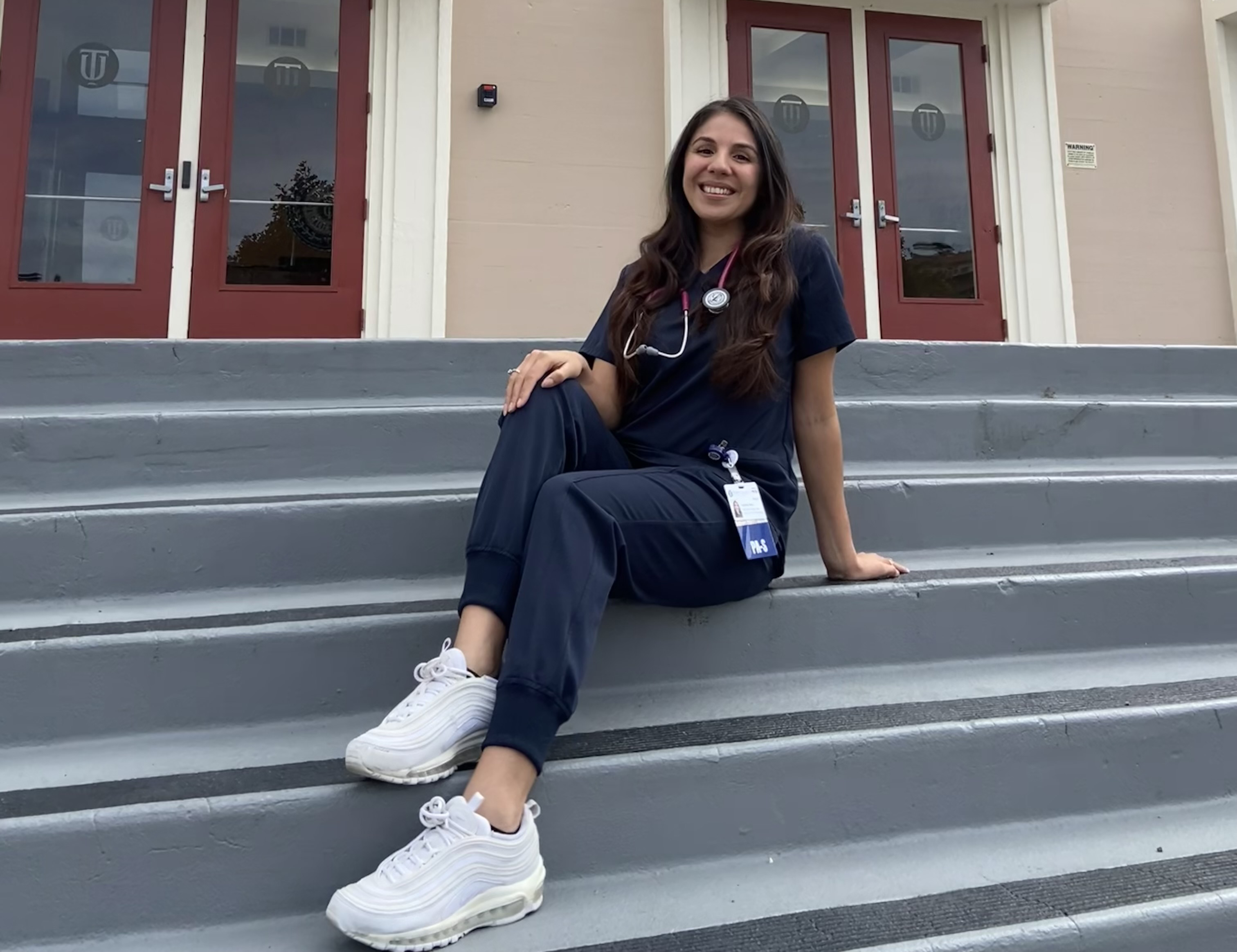 Carolina Rios is shown on the steps of Lander Hall on the Touro University California campus. Rios is the recipient of a $2,000 Lt. Ruth Cortes PA-C Scholarship.