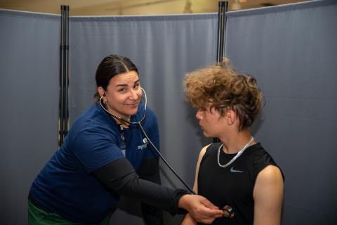 Nurse gives a physical at JBHS