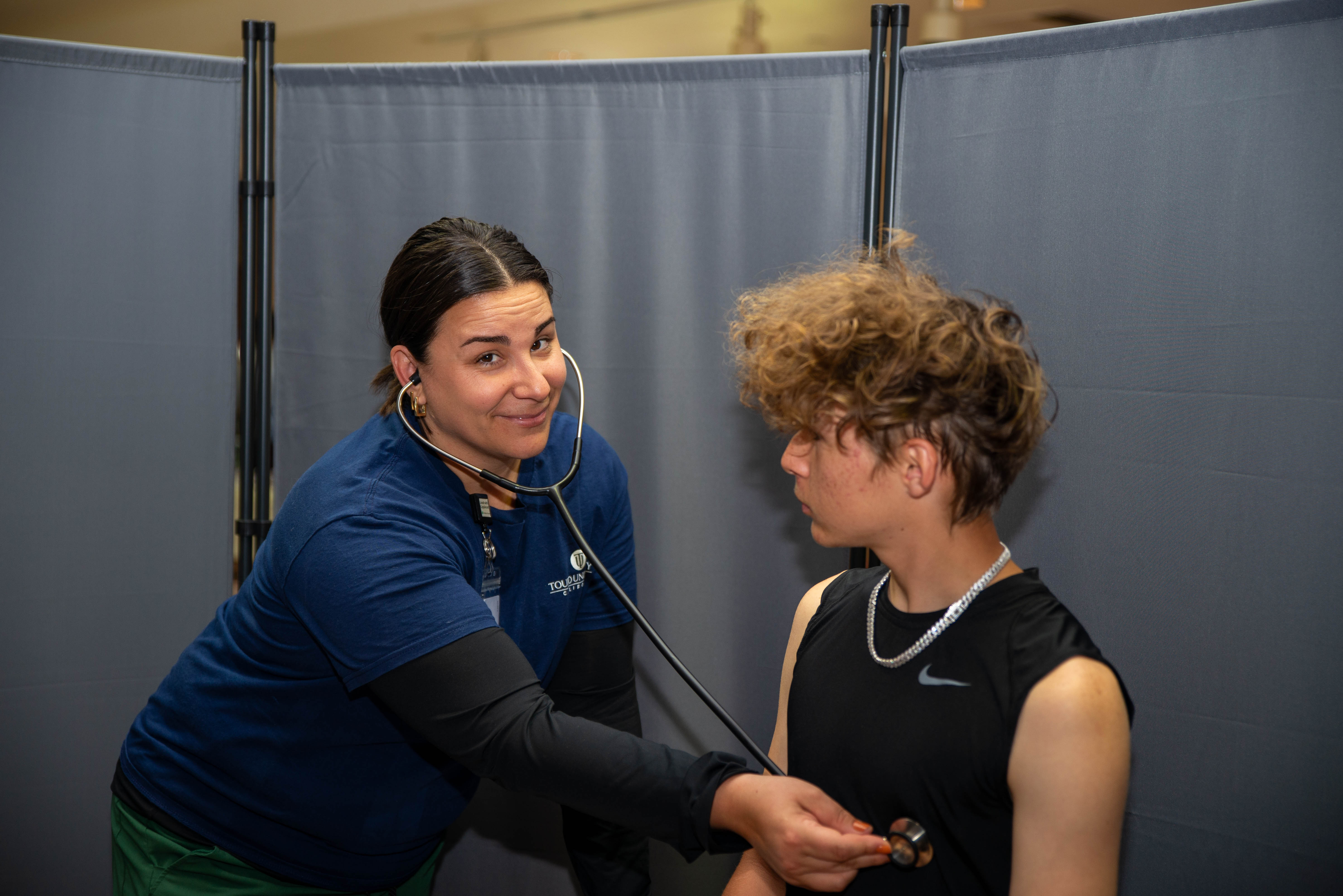Nurse gives a physical at JBHS