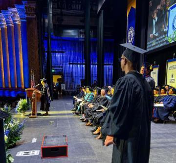 Obie Anthony waits for his name to be called for commencement
