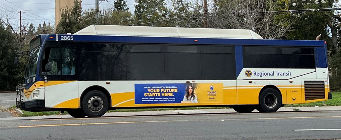 A photo shows a transit bus with an advertisement on its side promoting the College of Pharmacy\'s PharmD program at Touro University California. The marketing campaign was recognized with a Bronze award in late June from the Council for Advancement and Support of Education, better known as CASE.