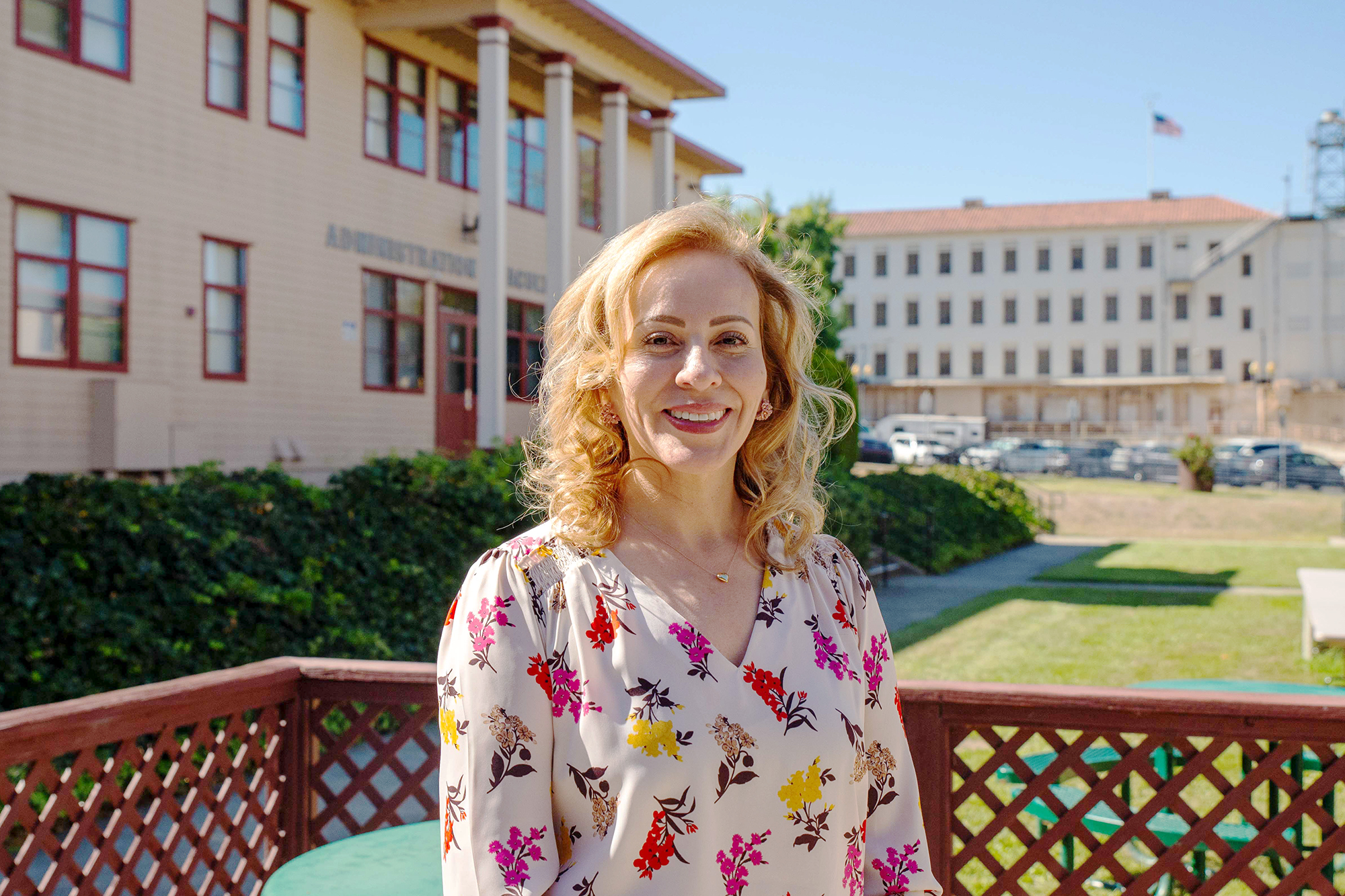 Dr. Patricia Vargas, Director of the Diagnostic Medical Sonography, posing outdoors in front the Administration 2 building on the TUC Campus.