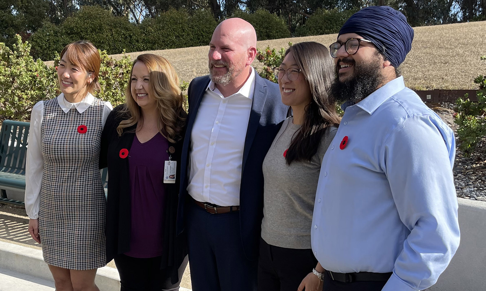 A photo shows participants in the Veterans Day ceremony at Touro University California include, from left to right, Student-Doctor Grace Hwang, MPH Class of 2022 and President of the Military Club on campus; Dr. Tami Hendriksz, Dean of the College of Osteopathic Medicine and Interim Chief Academic Officer for the University and a member of the College\'s Class of 2006; Dr. David Duncan, a Pioneer with the College of Osteopathic Medicine\'s inaugural Class of 2001 and a 20-year veteran; Student-Doctor Melody Wang; and Student-Doctor Gurmun Singh. The ceremony occurred at The Grove on Campus, Friday, Nov. 10, 2023.