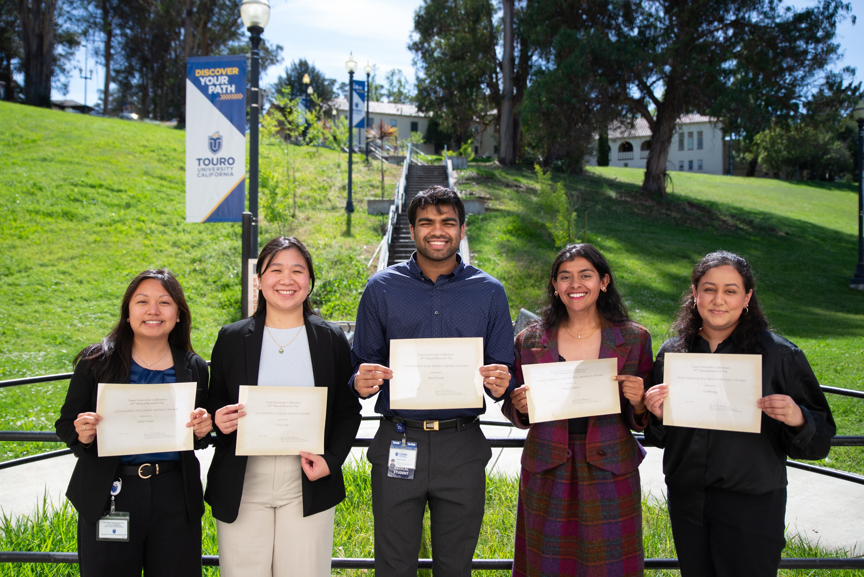 TUC students pose with their outstanding abstract awards.