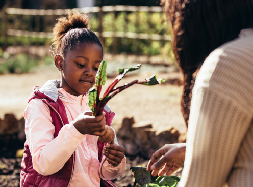 girls holds garden plant