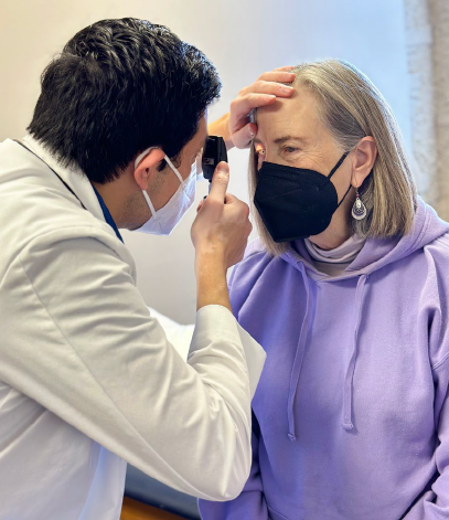 Physician Assistant Reviews Patient